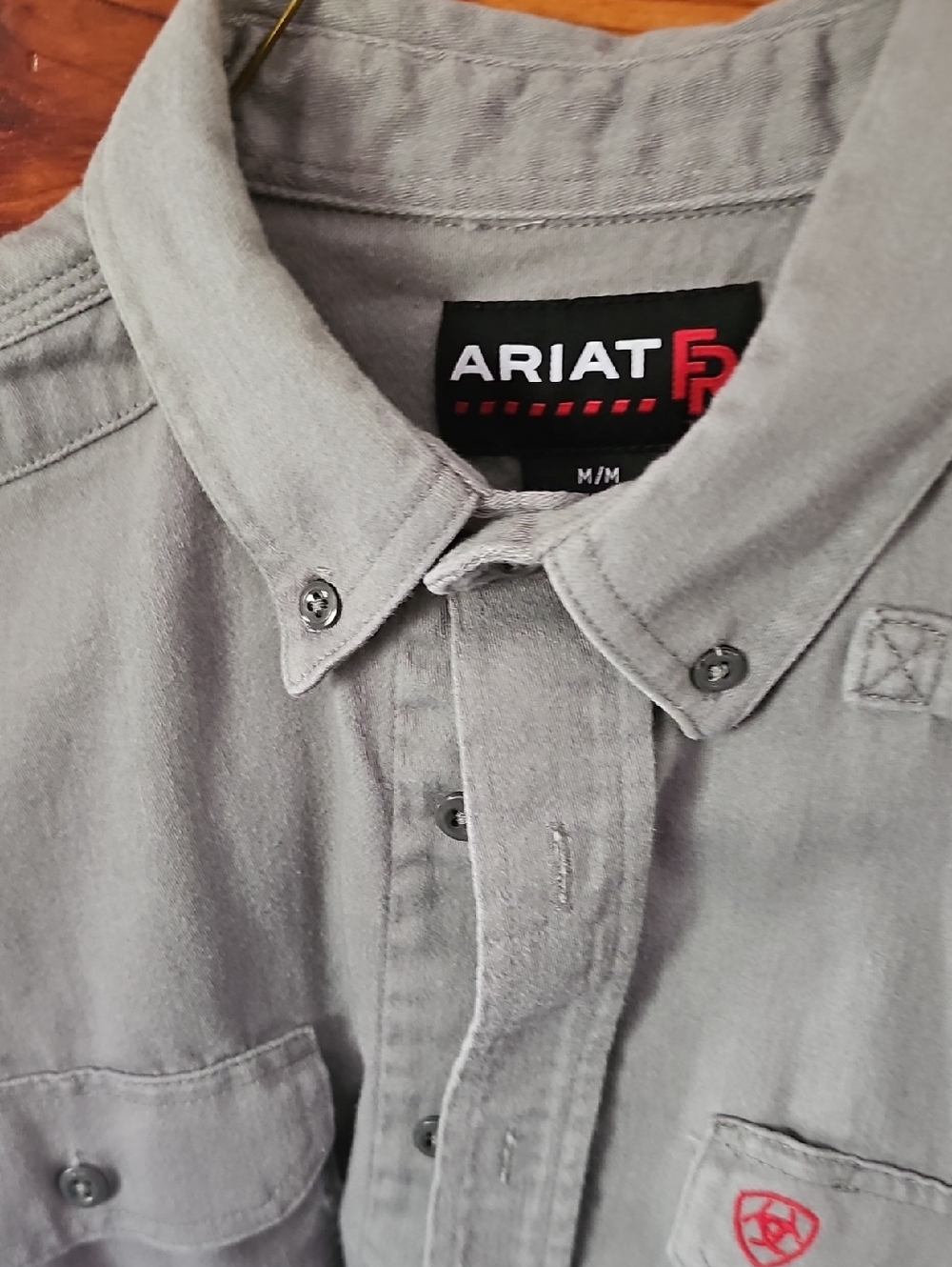 Ariat Light Gray Button-Down Work Shirt with Red Logo Accent. Flame Resistant